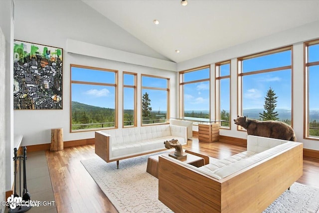 10500 Blackwolf Cir, Anchorage, AK 99507 - living area with wood-type flooring, lofted ceiling, and recessed lighting