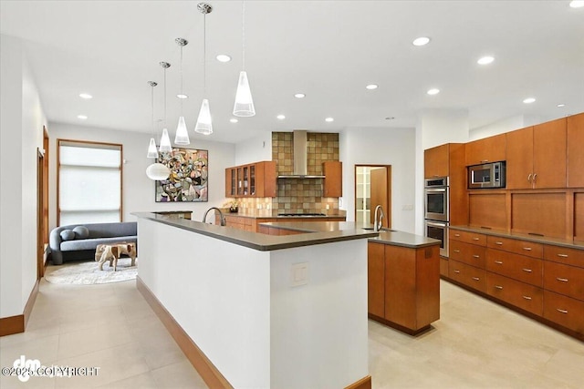 10500 Blackwolf Cir, Anchorage, AK 99507 - kitchen featuring a spacious island, wall chimney exhaust hood, stainless steel appliances, dark countertops, and recessed lighting