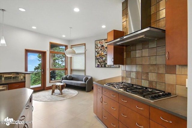 10500 Blackwolf Cir, Anchorage, AK 99507 - kitchen featuring wall chimney exhaust hood, stainless steel gas stovetop, backsplash, recessed lighting, and dark countertops