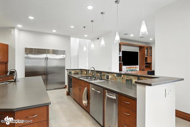 10500 Blackwolf Cir, Anchorage, AK 99507 - kitchen with stainless steel appliances, dark countertops, a large island with sink, and recessed lighting
