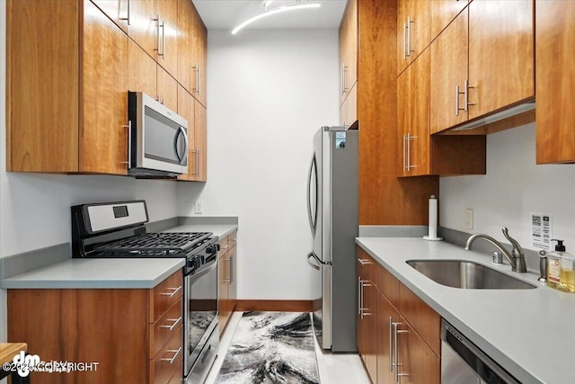 10500 Blackwolf Cir, Anchorage, AK 99507 - kitchen with stainless steel appliances, brown cabinets, and light countertops