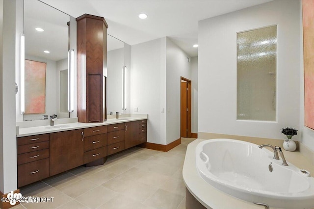 10500 Blackwolf Cir, Anchorage, AK 99507 - full bath with double vanity, a bath, recessed lighting, and tile patterned floors