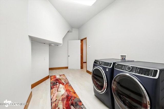 10500 Blackwolf Cir, Anchorage, AK 99507 - laundry area with washing machine and clothes dryer and baseboards