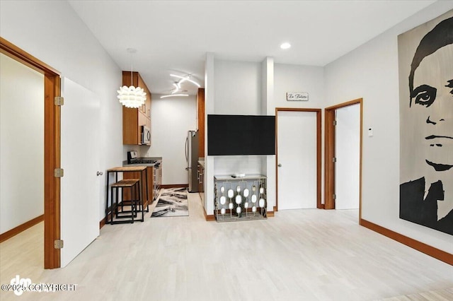 10500 Blackwolf Cir, Anchorage, AK 99507 - living area featuring light wood-type flooring and recessed lighting