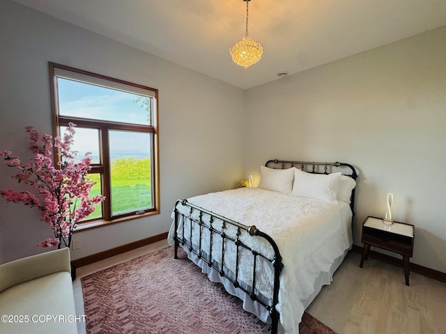 10500 Blackwolf Cir, Anchorage, AK 99507 - bedroom featuring baseboards and light wood-type flooring