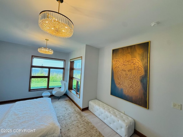 10500 Blackwolf Cir, Anchorage, AK 99507 - bedroom with a chandelier and wood finished floors
