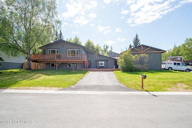 4530 Macalister Dr, Anchorage, AK 99502 - view of front of property featuring driveway, a wooden deck, and a front yard