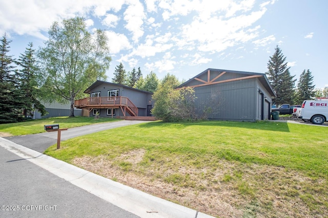 4530 Macalister Dr, Anchorage, AK 99502 - view of front of house with a wooden deck, a front lawn, and stairs