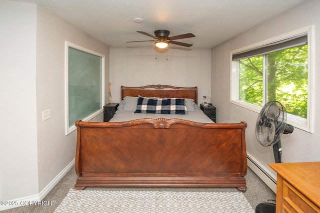 4530 Macalister Dr, Anchorage, AK 99502 - bedroom featuring a baseboard heating unit, light carpet, baseboards, and a ceiling fan