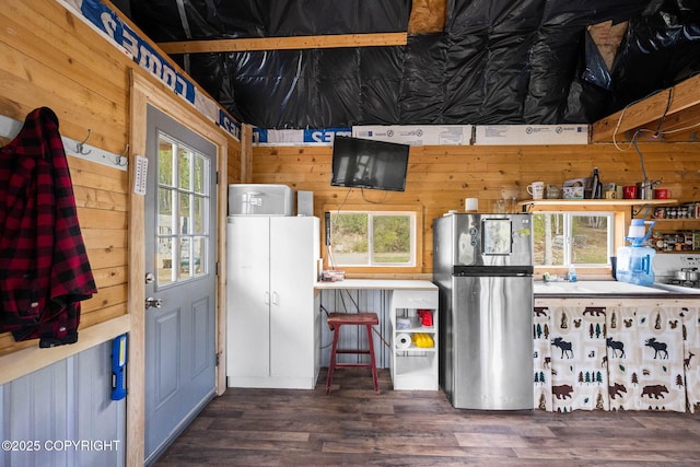 6360 Haystack Dr, Fairbanks, AK 99712 - kitchen with freestanding refrigerator, wooden walls, and wood finished floors