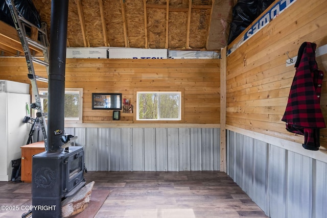 6360 Haystack Dr, Fairbanks, AK 99712 - interior space featuring a wood stove, wood walls, and wood finished floors