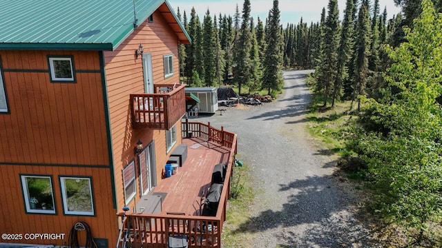 33426 Mid River Ave, Soldotna, AK 99669 - view of home's exterior with a forest view and dirt driveway