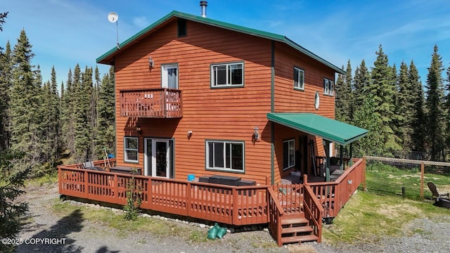 33426 Mid River Ave, Soldotna, AK 99669 - rear view of property with a balcony, a deck, and a forest view