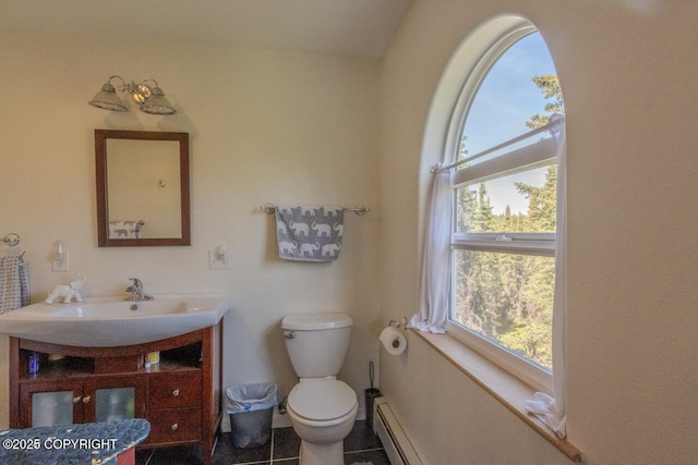 33426 Mid River Ave, Soldotna, AK 99669 - bathroom featuring vanity, healthy amount of natural light, and a baseboard radiator