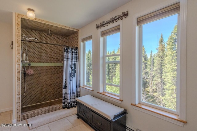 33426 Mid River Ave, Soldotna, AK 99669 - bathroom featuring tiled shower and tile patterned flooring