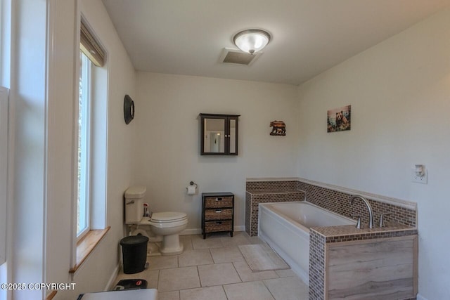 33426 Mid River Ave, Soldotna, AK 99669 - bathroom featuring a garden tub and tile patterned floors