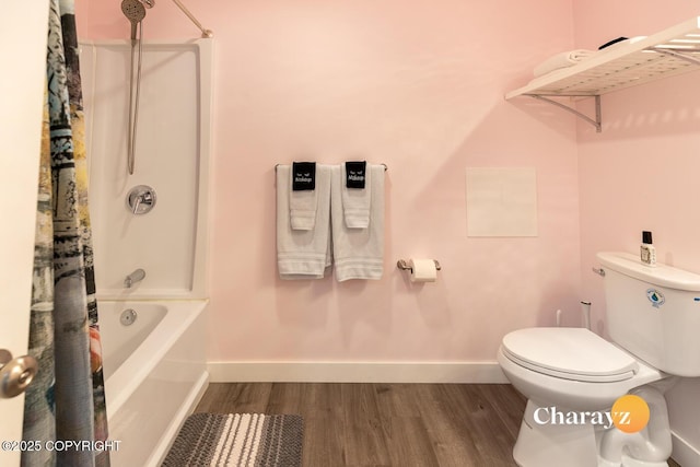 799 8th Ave, Fairbanks, AK 99701 - full bathroom with wood finished floors, toilet, shower / tub combo with curtain, and baseboards