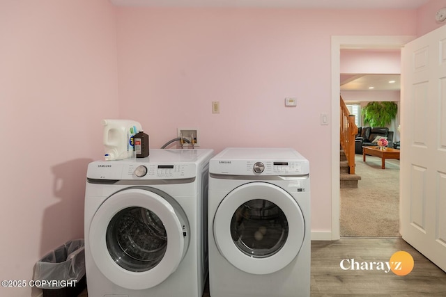 799 8th Ave, Fairbanks, AK 99701 - laundry area featuring washer and dryer and light wood-type flooring