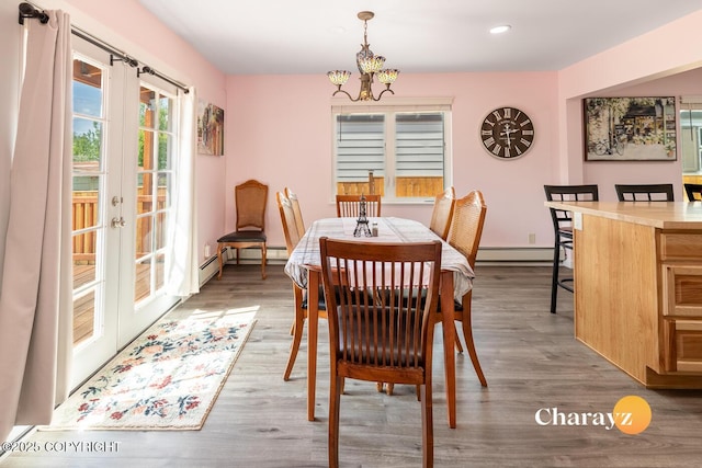 799 8th Ave, Fairbanks, AK 99701 - dining room with a baseboard radiator, wood finished floors, a chandelier, recessed lighting, and french doors