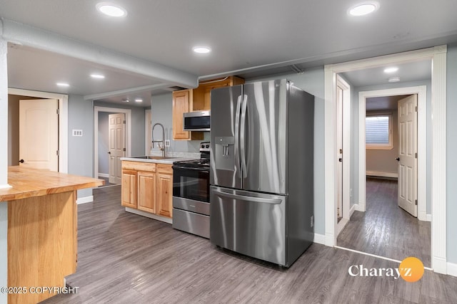 799 8th Ave, Fairbanks, AK 99701 - kitchen featuring appliances with stainless steel finishes, wooden counters, baseboards, dark wood finished floors, and recessed lighting