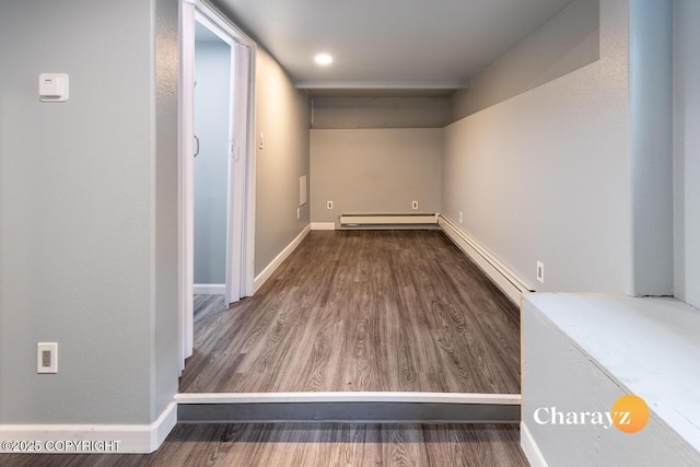799 8th Ave, Fairbanks, AK 99701 - basement featuring wood finished floors, a baseboard radiator, and baseboards