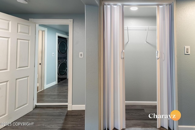 799 8th Ave, Fairbanks, AK 99701 - hallway with stacked washer and clothes dryer, dark wood-style flooring, and baseboards
