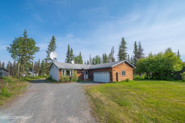 48160 Snowflake Ct, Soldotna, AK 99669 - view of front facade featuring dirt driveway, an attached garage, a chimney, and a front yard