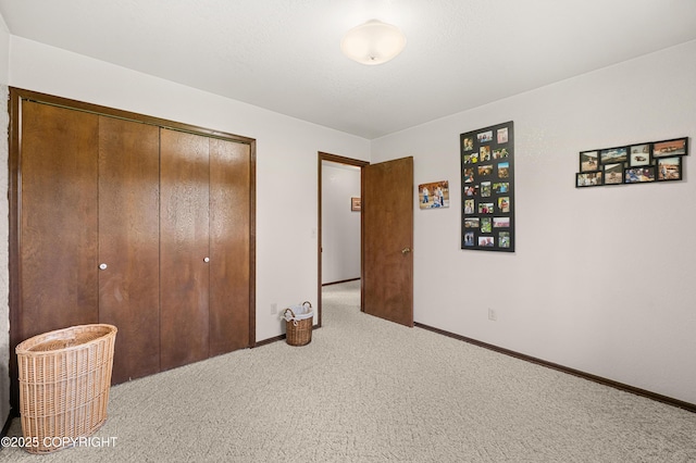 48160 Snowflake Ct, Soldotna, AK 99669 - carpeted bedroom with a closet and baseboards