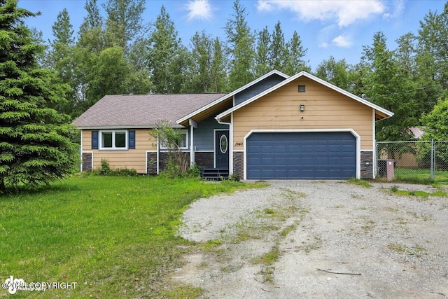 1940 E Caribou Loop, Wasilla, AK 99654 - ranch-style house featuring stone siding, dirt driveway, and a garage