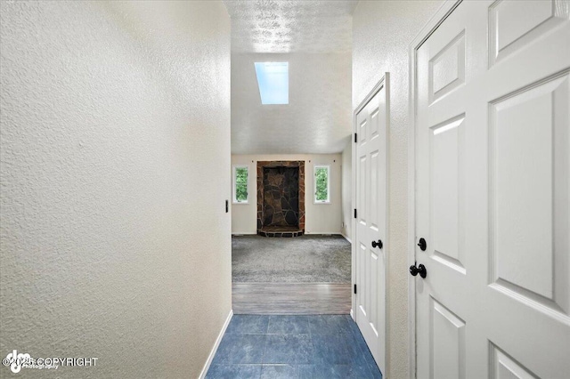 1940 E Caribou Loop, Wasilla, AK 99654 - hallway with a textured wall and dark tile patterned floors
