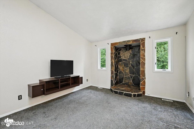 1940 E Caribou Loop, Wasilla, AK 99654 - carpeted living area with baseboards and vaulted ceiling