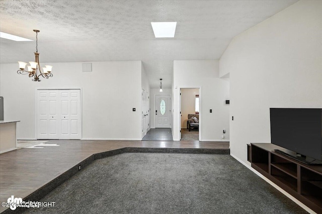 1940 E Caribou Loop, Wasilla, AK 99654 - unfurnished living room with a chandelier, carpet, and a textured ceiling