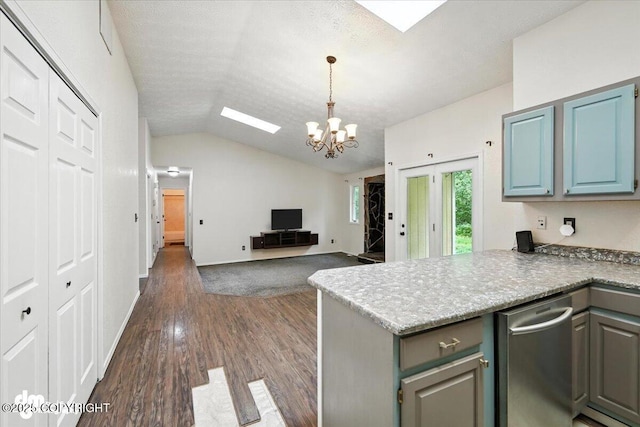1940 E Caribou Loop, Wasilla, AK 99654 - kitchen featuring lofted ceiling, dark wood finished floors, a chandelier, a peninsula, and hanging light fixtures