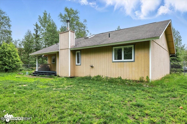 1940 E Caribou Loop, Wasilla, AK 99654 - rear view of property with a chimney and a shingled roof