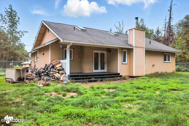 1940 E Caribou Loop, Wasilla, AK 99654 - rear view of house with french doors, a chimney, and a shingled roof