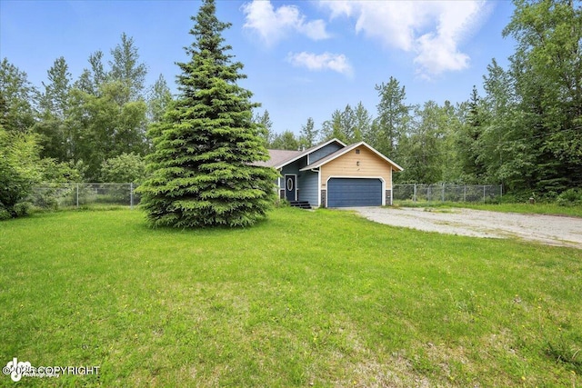1940 E Caribou Loop, Wasilla, AK 99654 - view of front of home featuring dirt driveway and a garage