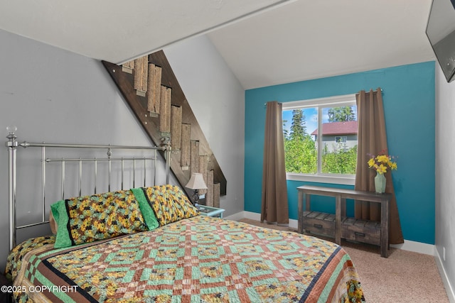 41167 Witman Ct, Soldotna, AK 99669 - bedroom featuring baseboards, carpet floors, and vaulted ceiling