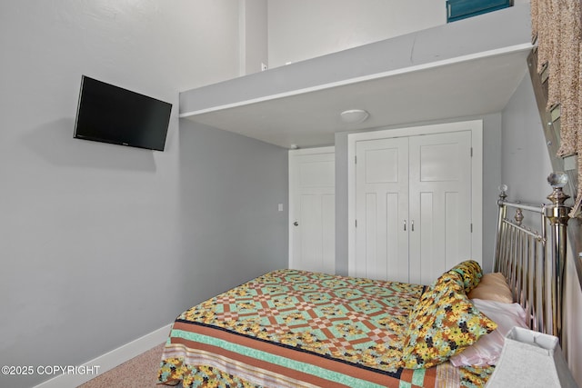 41167 Witman Ct, Soldotna, AK 99669 - bedroom with baseboards, a closet, and carpet