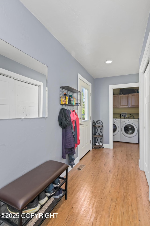 41167 Witman Ct, Soldotna, AK 99669 - mudroom with separate washer and dryer, light wood finished floors, baseboards, and recessed lighting