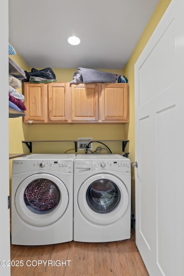 41167 Witman Ct, Soldotna, AK 99669 - washroom featuring cabinet space, independent washer and dryer, and light wood-style floors