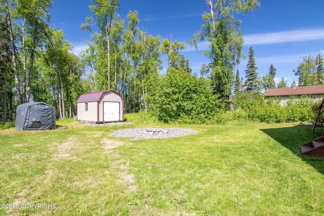 41167 Witman Ct, Soldotna, AK 99669 - view of grassy yard featuring a garage