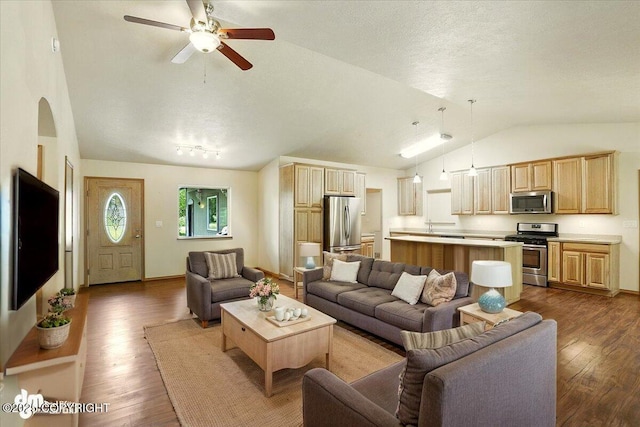 3963 N Coronado St, Wasilla, AK 99623 - living room with vaulted ceiling, dark wood-style floors, and a ceiling fan