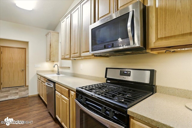 3963 N Coronado St, Wasilla, AK 99623 - kitchen with stainless steel appliances, light countertops, dark wood-style floors, and light brown cabinetry
