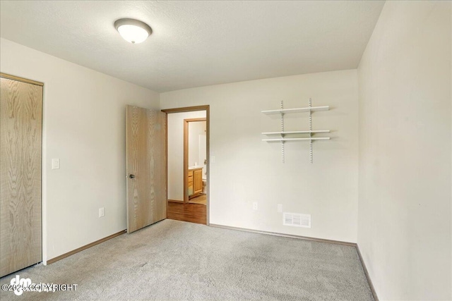 3963 N Coronado St, Wasilla, AK 99623 - unfurnished bedroom featuring carpet and baseboards