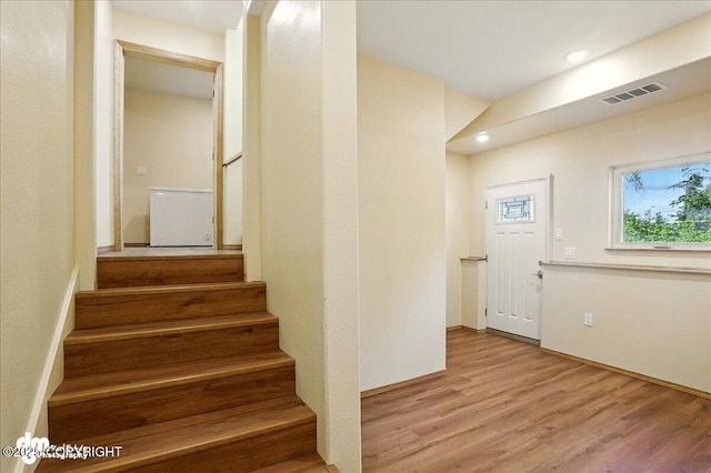 3963 N Coronado St, Wasilla, AK 99623 - stairway with wood finished floors and recessed lighting