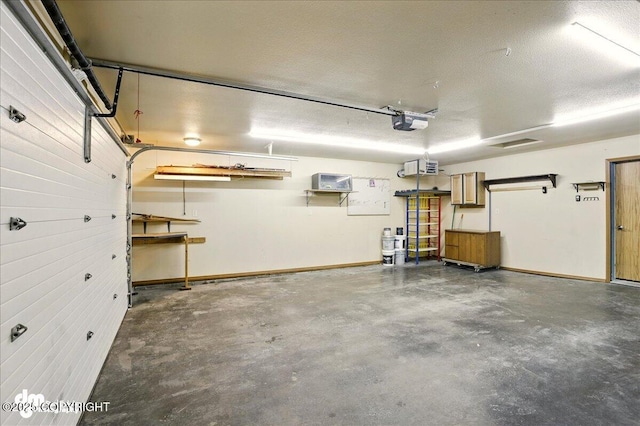 3963 N Coronado St, Wasilla, AK 99623 - garage featuring a garage door opener