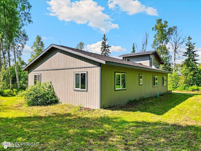 3963 N Coronado St, Wasilla, AK 99623 - view of side of home featuring a yard