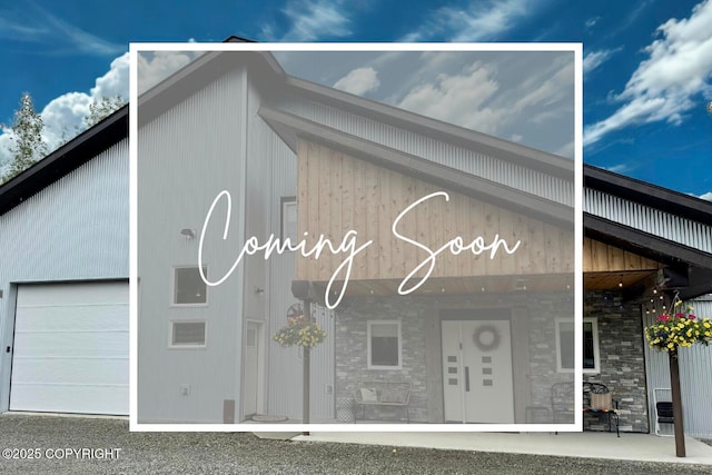 6961 S Hangar Talk Cir, Wasilla, AK 99623 - view of property with a garage