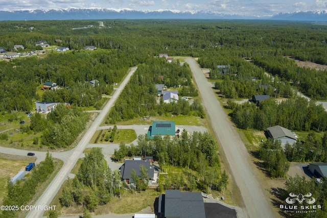 6961 S Hangar Talk Cir, Wasilla, AK 99623 - aerial view of property and surrounding area with a heavily wooded area