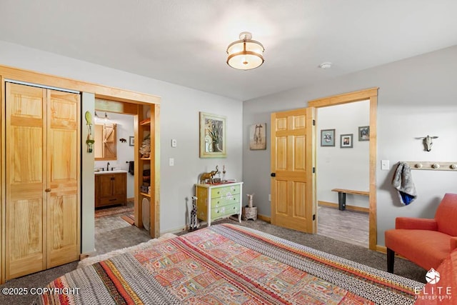 6961 S Hangar Talk Cir, Wasilla, AK 99623 - carpeted bedroom featuring baseboards and connected bathroom